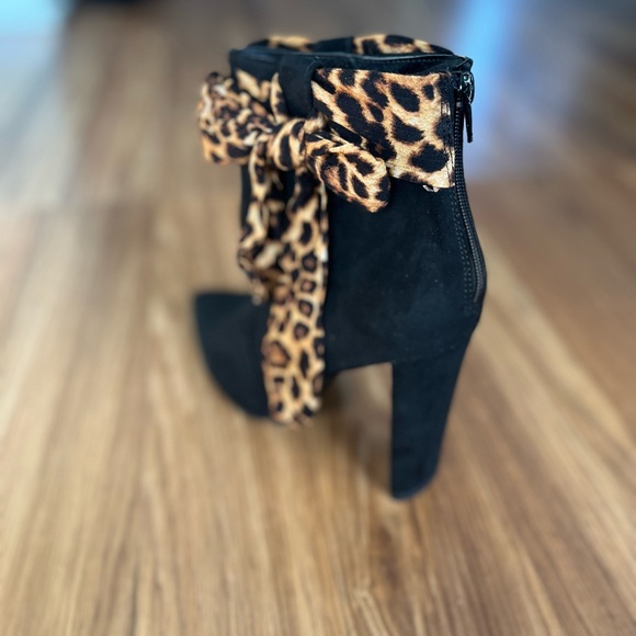 JustFab Black Heeled Boots with Leopard Bow - Picture 2 of 6